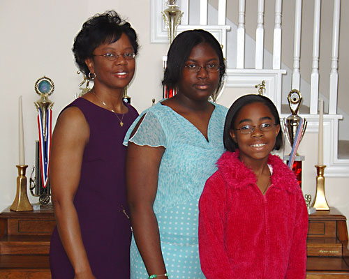 Mom and girls...Kristyn's half smile.